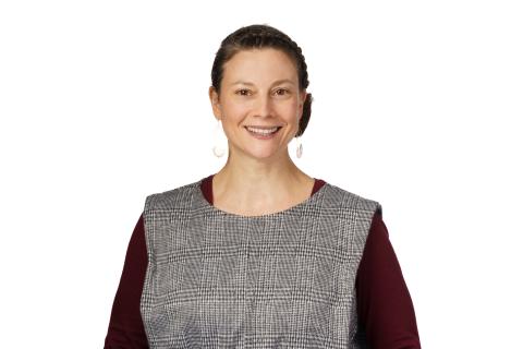 smiling woman with a maroon shirt