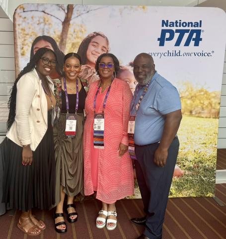 Topaz and Chioma pose with partners at the PTA conference